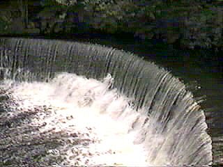 Horseshe waterfall on river Colne at milnsbridge
